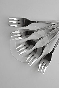 Same Three Pronged Forks Laid Out In A Fan Shape Isolated On White