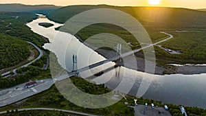 Sami Bridge and Teno river, summer, golden hour in Utsjoki