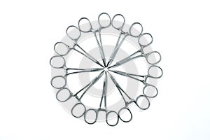 Samll surgical clamps arranged in a circle