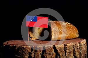 Samoa flag on a stump with bread