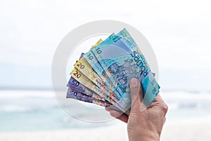 Samoan Tala currency - right hand holding bank notes from Western Samoa photo