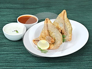 Samosa, stuffed with mixed masala potatoes, Indian special traditional street food also known as punjabi samosa,aloo samosa.served