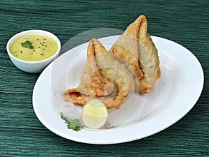 Samosa, stuffed with mixed masala potatoes, Indian special traditional street food also known as punjabi samosa,aloo samosa.served
