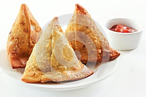 Samosas Indian snack food on white background