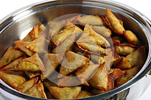 Samosas in a serving bowl