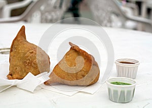 Samosas on a white table