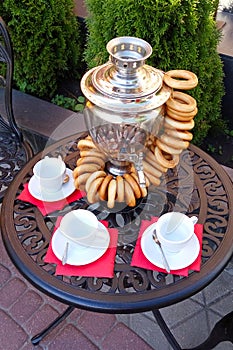 Samovar with bagels and cup on the table. Afternoon tea.