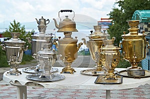 Samovars and kettles on the market outdoors
