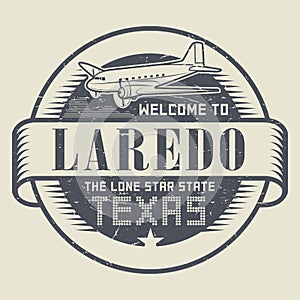Samp or tag with airplane and text Welcome to Texas, Laredo photo