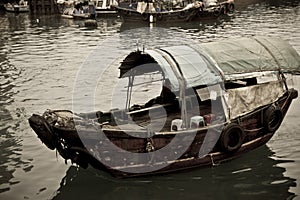A Sampan boat floating in the sea