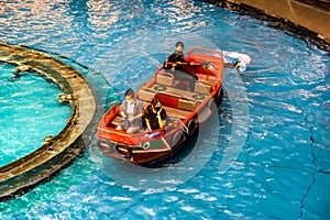 Sampan ride along the Canal at The Shoppes at Marina Bay Sands in a beautifully crafted Sampan boat.