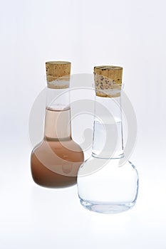 Sample of clean and dirty water isolated photo