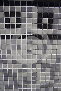 Sample of half grouted tiles in a swimming pool.