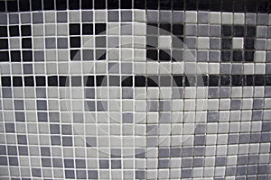 Sample of half grouted tiles in a swimming pool.