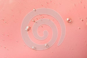 Sample of hydrophilic oil on pink background, top view