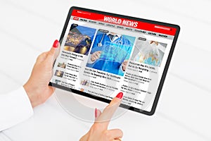 Sample news website shown on tablet photo