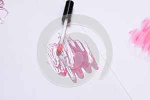 Sample of pink lip gloss on a white background