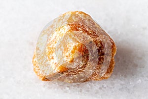 sample of raw heliolite sunstone mineral on white
