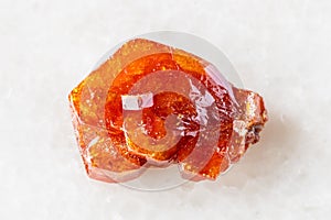 sample of raw vanadinite crystal on white marble