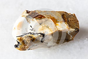 sample of rough common opal mineral on white