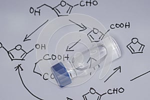 Sample vial on the paper