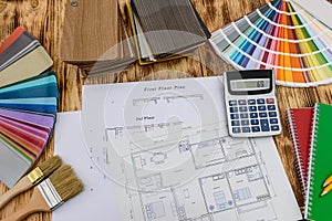 Samplers for decorating and house plan on desk