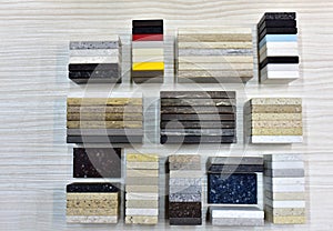 Samples of acrylic artificial stone for countertops. Artificial stone for interior decoration in the construction in houses.