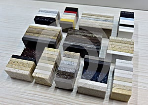 Samples of acrylic artificial stone for countertops. Artificial stone for interior decoration in the construction in houses.