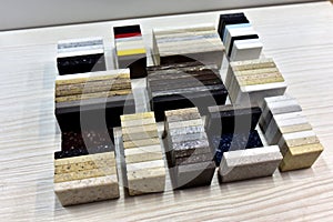 Samples of acrylic artificial stone for countertops. Artificial stone for interior decoration in the construction in houses.