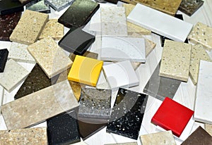 Samples of acrylic artificial stone for countertops. Artificial stone for interior decoration in the construction in houses.