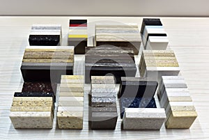 Samples of acrylic artificial stone for countertops. Artificial stone for interior decoration in the construction in houses.