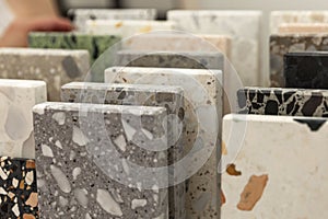 Samples of artificial stone. Interior design and renovation. Close-up. Selective focus