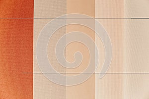 Samples of blinds for windows in the store. Plastic blinds, pleated, roll-up and day-night curtains in store