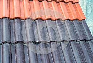 Samples of ceramic roofing tiles in a warehouse of a roofing mat