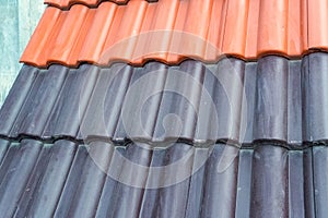 Samples of ceramic roofing tiles in a warehouse of a roofing mat