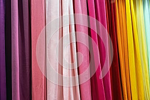 samples of cloth and fabrics in different colors found at a fabrics market