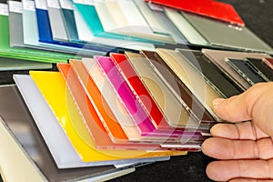 Samples of colored lacquered glass for interior finishing of apartments and offices, decorative glass photo