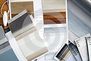 Samples of fabrics of different textures and colors in the form of a catalog for the selection of fabrics for fabric