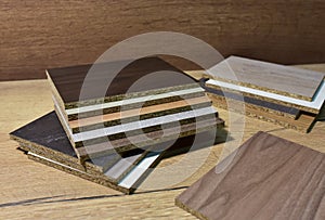 Samples of fibreboard panels with wood texture. Laminated CPD. Chipboard PVC edge. Wooden furniture CMD and MDF