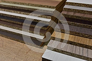 Samples of fibreboard panels with wood texture. Laminated CPD. Chipboard PVC edge. Wooden furniture CMD and MDF