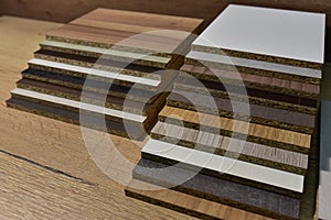 Samples of fibreboard panels with wood texture. Laminated CPD. Chipboard PVC edge. Wooden furniture CMD and MDF