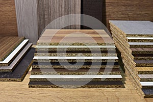 Samples of fibreboard panels with wood texture. Laminated CPD. Chipboard PVC edge. Wooden furniture CMD and MDF