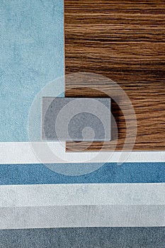 samples of finishing materials, close-up view, including various wooden laminates, interior wallpaper, gray artificial stone