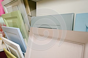 Samples of kitchen facades in a showroom for furniture production