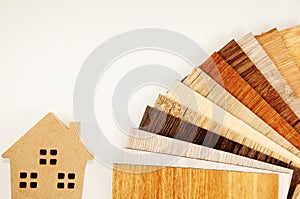 Samples of laminate and vinyl floor tile on isolate white Background.wood texture floor. home decoration with laminate.