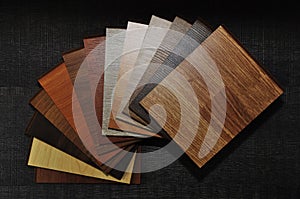 Samples of laminate and vinyl floor tile on wooden Background.wood texture floor