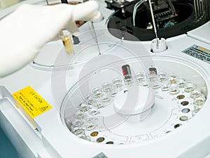 Samples from medical tests are loaded into the device