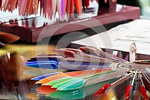 Samples of nail polish of different colors and shades applied to the tester plate.