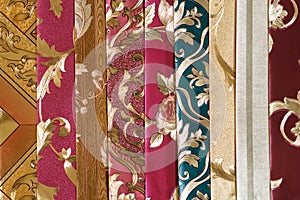 Samples for selecting the color of the interior walls. Book of Wallpaper samples for the designer`s work