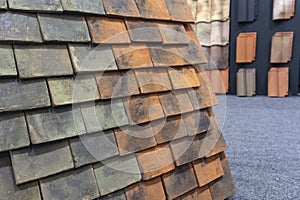 Samples shingles for the roof in the exhibition hall. Construction industrySamples shingles for the roof in the exhibition hall. C